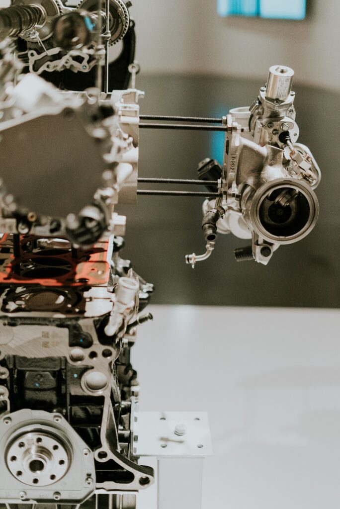 Automotive engine with strain gauge load measurement sensors